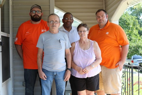 Home Depot representatives with LifeCare Alliance clients and staff