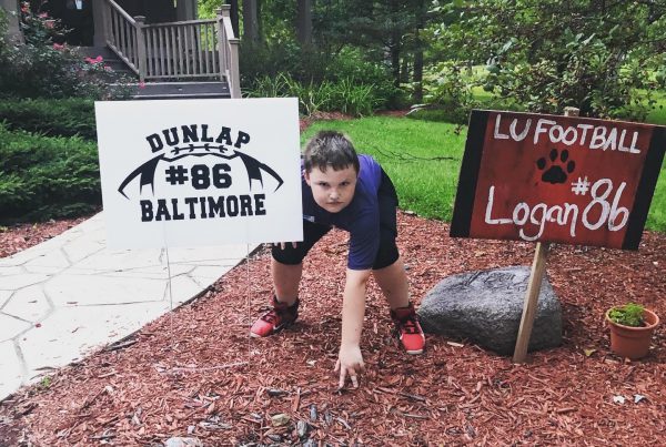 Logan in a football pose